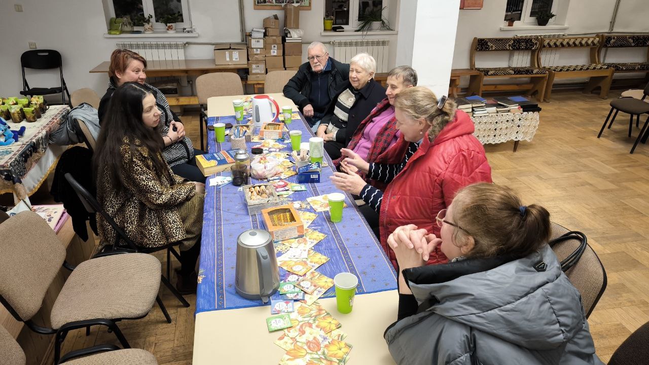 a group of people at a prayer meeting