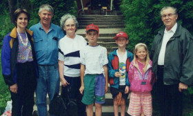 a family portrait taken outdoors