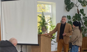 Sasha and a young woman in the church auditorium