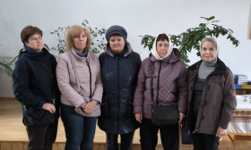 group of ladies with grocery bags
