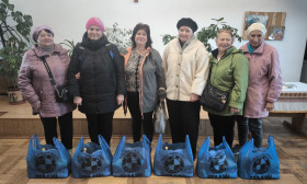 group of ladies with grocery bags