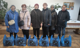 group of people with grocery bags
