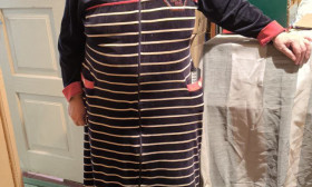 woman standing in hallway of apartment