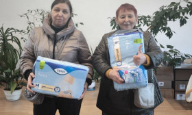 two ladies holding products