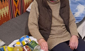 elderly woman with a bag of groceries