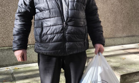 man standing outside church