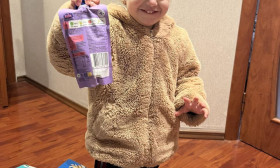 child holding a product