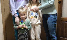 four children standing in their home