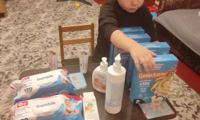 a young boy looking at food products