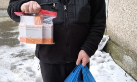 man standing with products