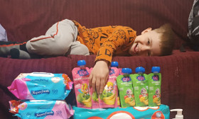 boy lying on couch and laughing