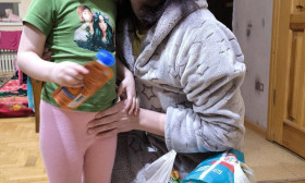 A heartwarming image of a mother and child with a bag of humanitarian aid, symbolizing hope and support.